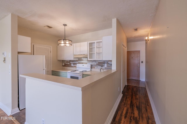 701 W Locust St Unit 34, Johnson City, TN 37604 - kitchen featuring white appliances, dark wood-style floors, backsplash, white cabinetry, and a textured ceiling