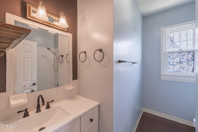 701 W Locust St Unit 34, Johnson City, TN 37604 - bathroom featuring decorative backsplash, vanity, and a shower