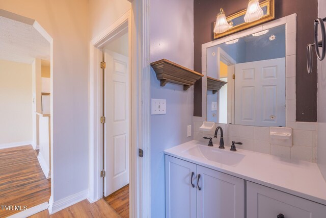 701 W Locust St Unit 34, Johnson City, TN 37604 - bathroom with backsplash, wood finished floors, and vanity