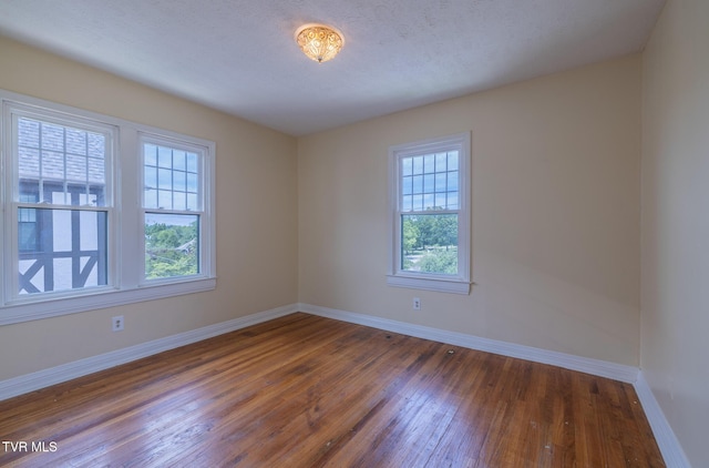 701 W Locust St Unit 34, Johnson City, TN 37604 - unfurnished room featuring hardwood / wood-style floors and baseboards