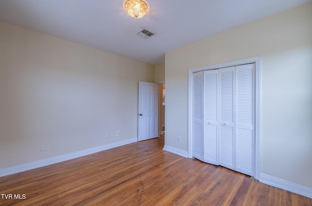 701 W Locust St Unit 34, Johnson City, TN 37604 - unfurnished bedroom featuring wood finished floors and a closet