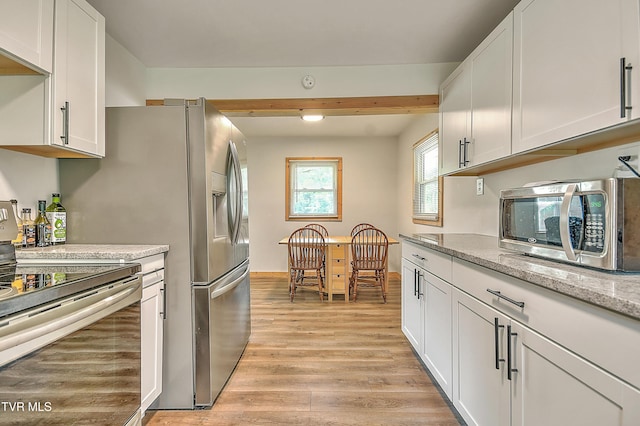 524 Boring Chapel Rd, Gray, TN 37615 - kitchen with stainless steel appliances, light wood-style flooring, white cabinetry, light stone counters, and beamed ceiling