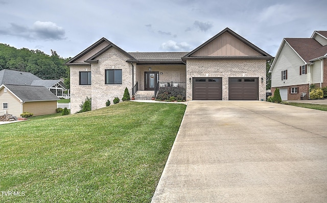 55 Farmstead Ln, Jonesborough, TN 37659 - view of front of house featuring brick siding, concrete driveway, a garage, a front lawn, and board and batten siding