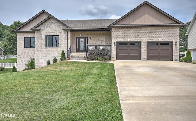55 Farmstead Ln, Jonesborough, TN 37659 - view of front of house with board and batten siding, concrete driveway, brick siding, and a garage