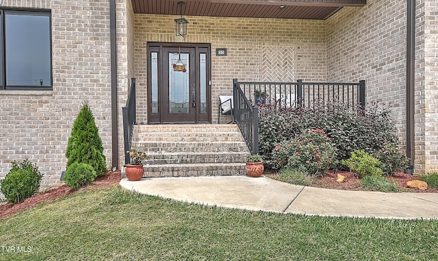 55 Farmstead Ln, Jonesborough, TN 37659 - property entrance with covered porch, brick siding, and a yard