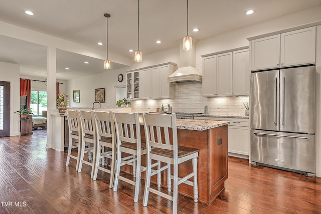 55 Farmstead Ln, Jonesborough, TN 37659 - kitchen featuring freestanding refrigerator, custom range hood, a kitchen bar, dark wood finished floors, and recessed lighting