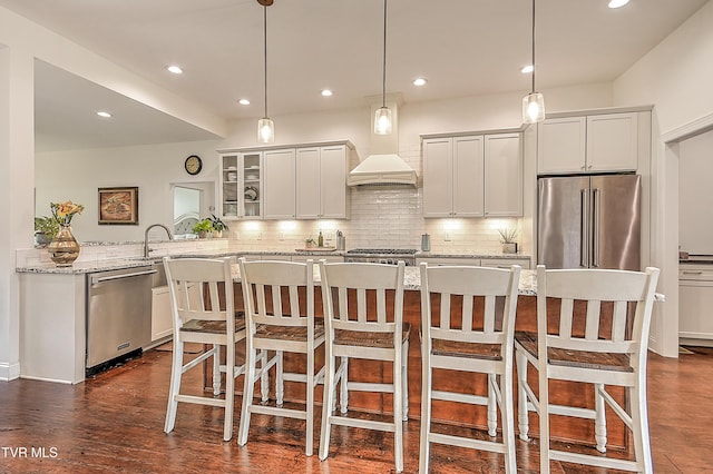 55 Farmstead Ln, Jonesborough, TN 37659 - kitchen with appliances with stainless steel finishes, decorative backsplash, recessed lighting, glass insert cabinets, and a breakfast bar area