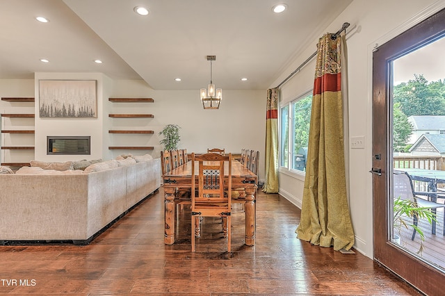 55 Farmstead Ln, Jonesborough, TN 37659 - dining area with recessed lighting, dark wood-style flooring, a chandelier, and a glass covered fireplace
