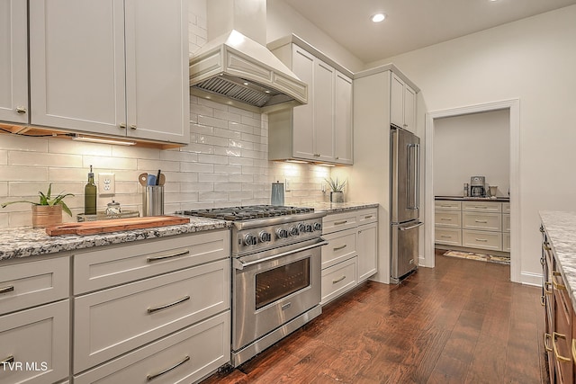 55 Farmstead Ln, Jonesborough, TN 37659 - kitchen with wall chimney range hood, premium appliances, light stone countertops, dark wood-style flooring, and recessed lighting