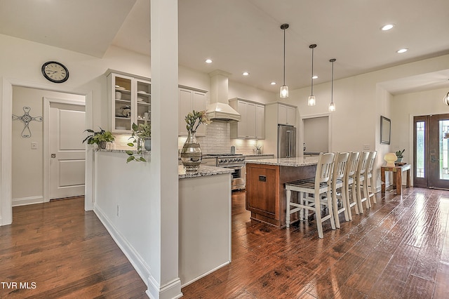 55 Farmstead Ln, Jonesborough, TN 37659 - kitchen with premium range hood, high end appliances, dark wood finished floors, a kitchen breakfast bar, and tasteful backsplash