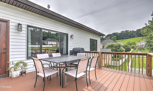 55 Farmstead Ln, Jonesborough, TN 37659 - wooden deck featuring grilling area, outdoor dining space, and a lawn