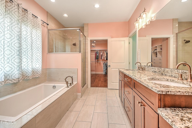 55 Farmstead Ln, Jonesborough, TN 37659 - full bathroom featuring a spacious closet, a shower stall, a bath, double vanity, and recessed lighting