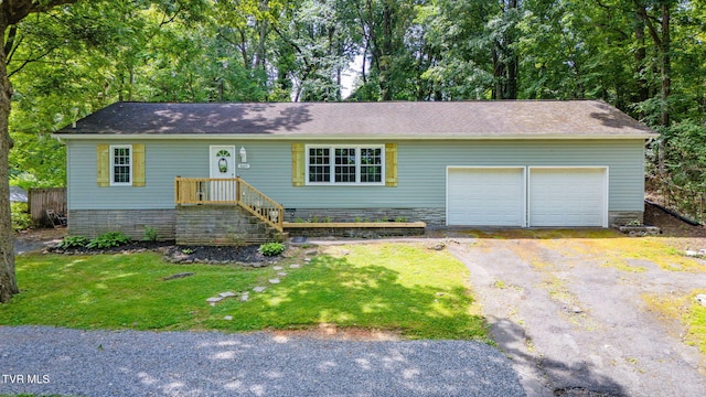 3025 Shipley St, Kingsport, TN 37664 - single story home featuring a garage, asphalt driveway, and a front lawn