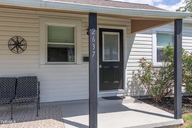 2637 Bay St, Bristol, TN 37620 - view of exterior entry with a shingled roof and crawl space