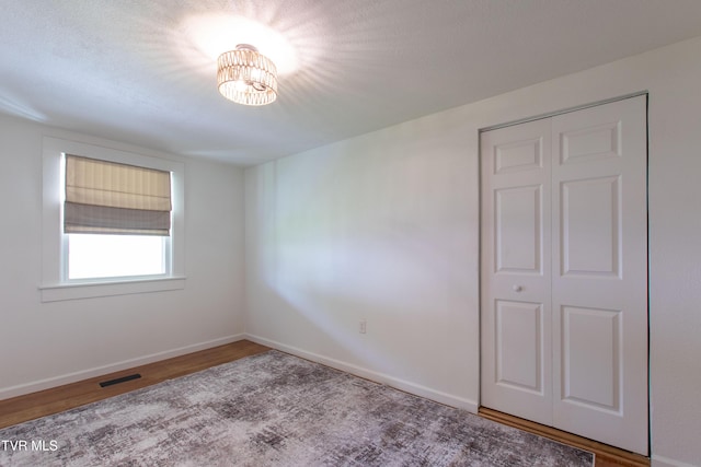 2637 Bay St, Bristol, TN 37620 - empty room with wood finished floors and a chandelier