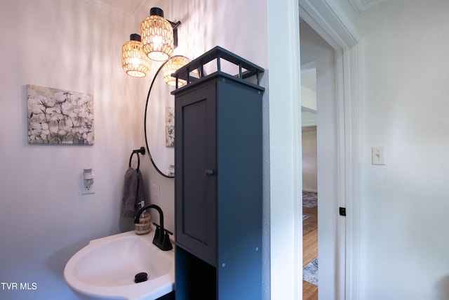2637 Bay St, Bristol, TN 37620 - bathroom with a chandelier, crown molding, and wood finished floors
