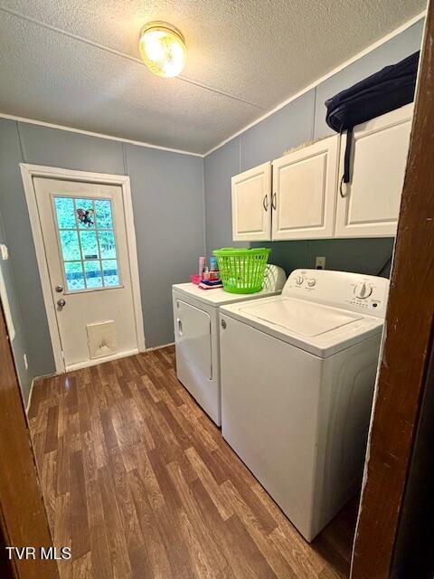 222 SW Azalea Dr, Wise, VA 24293 - washroom with cabinet space, washer and clothes dryer, dark wood-style flooring, and a textured ceiling