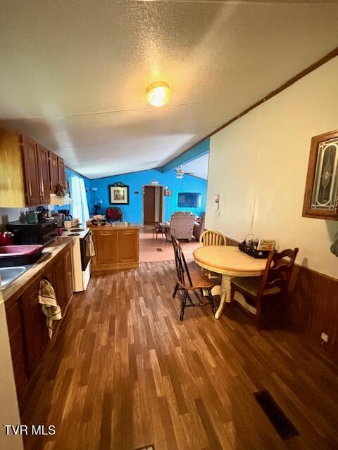 222 SW Azalea Dr, Wise, VA 24293 - dining space with vaulted ceiling and wood finished floors