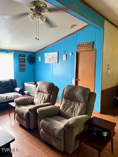 222 SW Azalea Dr, Wise, VA 24293 - living room with lofted ceiling, a ceiling fan, wood finished floors, and ornamental molding