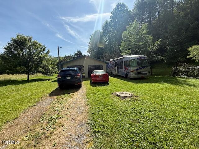 123 Mcmahan Gibbs Rd, Roan Mountain, TN 37687 - view of yard featuring a detached garage and an outdoor structure