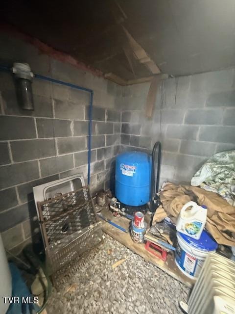 123 Mcmahan Gibbs Rd, Roan Mountain, TN 37687 - detailed view of concrete block wall and a water pressure tank