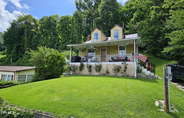 3135 3rd Ave, Saint Paul, VA 24283 - view of front of home featuring a porch, a front lawn, and a metal roof
