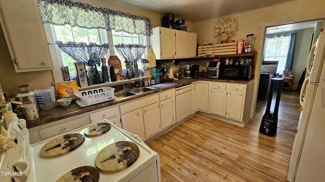 3135 3rd Ave, Saint Paul, VA 24283 - kitchen featuring white appliances, light wood finished floors, and plenty of natural light