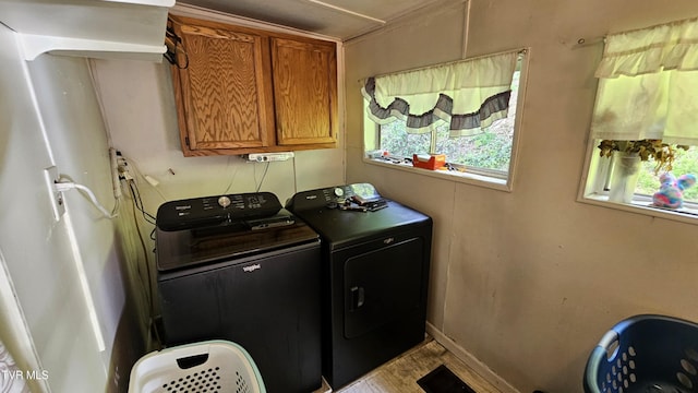 3135 3rd Ave, Saint Paul, VA 24283 - washroom with cabinet space, washing machine and clothes dryer, and wood finished floors