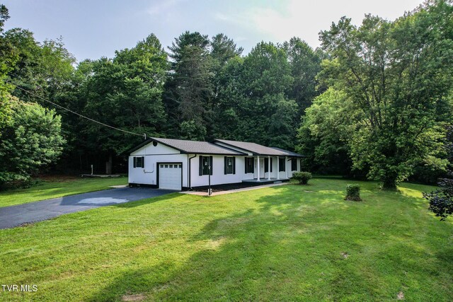 113 Paul Mathes Rd, Chuckey, TN 37641 - single story home with driveway, a garage, a front yard, and a shingled roof