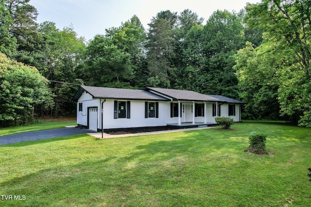 113 Paul Mathes Rd, Chuckey, TN 37641 - ranch-style home with covered porch, driveway, an attached garage, and a front yard