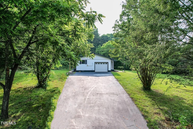 113 Paul Mathes Rd, Chuckey, TN 37641 - view of front of property with driveway, a front lawn, and a garage