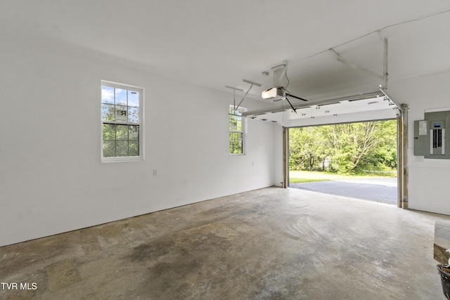 113 Paul Mathes Rd, Chuckey, TN 37641 - garage featuring electric panel and a garage door opener