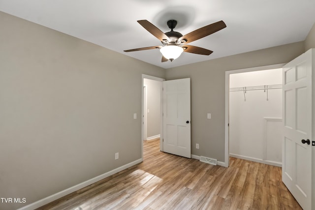 113 Paul Mathes Rd, Chuckey, TN 37641 - unfurnished bedroom with light wood-style flooring, a closet, and a ceiling fan