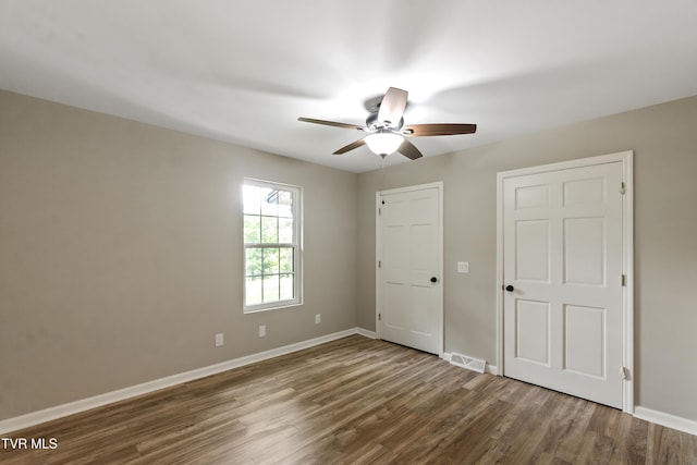 113 Paul Mathes Rd, Chuckey, TN 37641 - unfurnished bedroom with dark wood-type flooring and ceiling fan