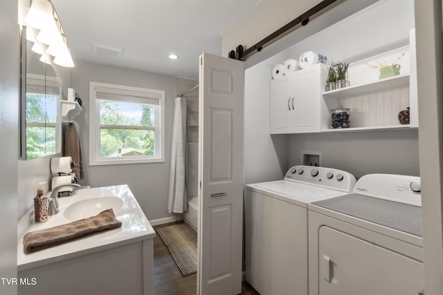 1908 Old Tusculum Rd, Greeneville, TN 37745 - laundry area with independent washer and dryer, a barn door, recessed lighting, dark wood finished floors, and cabinet space