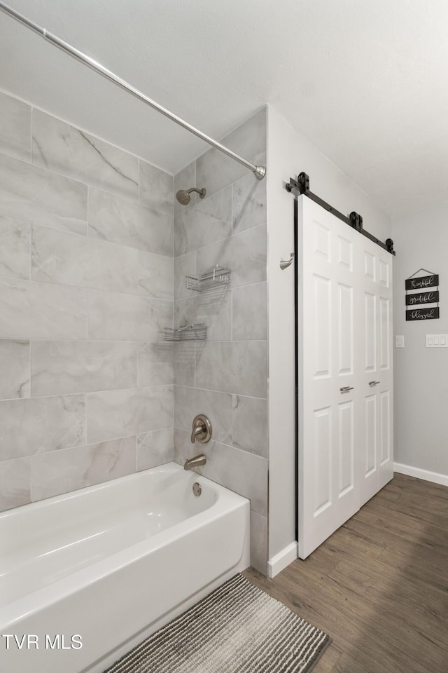 1908 Old Tusculum Rd, Greeneville, TN 37745 - bathroom with washtub / shower combination and wood finished floors