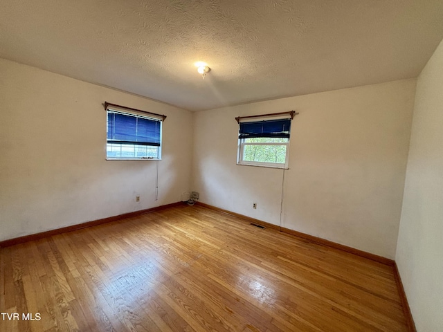6361 Dr Thomas Walker Rd, Rose Hill, VA 24281 - spare room featuring light wood-style flooring and a textured ceiling