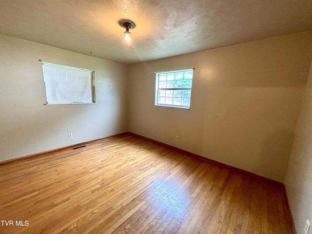 6361 Dr Thomas Walker Rd, Rose Hill, VA 24281 - spare room featuring hardwood / wood-style floors and a textured ceiling