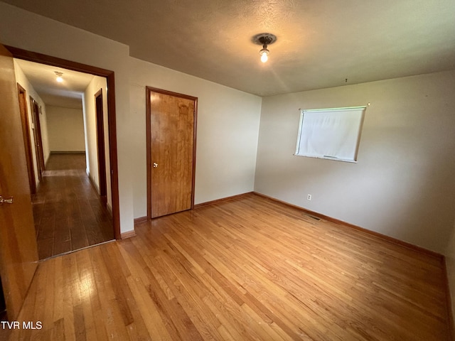 6361 Dr Thomas Walker Rd, Rose Hill, VA 24281 - unfurnished bedroom with wood-type flooring and a closet