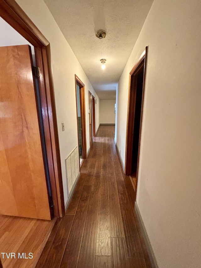 6361 Dr Thomas Walker Rd, Rose Hill, VA 24281 - corridor with dark wood-style floors and a textured ceiling