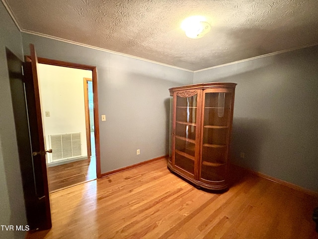 6361 Dr Thomas Walker Rd, Rose Hill, VA 24281 - spare room with wood finished floors, crown molding, and a textured ceiling