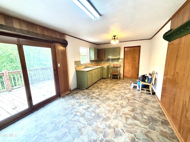 6361 Dr Thomas Walker Rd, Rose Hill, VA 24281 - kitchen featuring stone flooring, under cabinet range hood, backsplash, gray cabinets, and light countertops