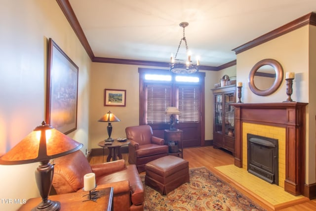 940 Park St, Bristol, VA 24201 - living room featuring ornamental molding, a chandelier, wood finished floors, and a fireplace