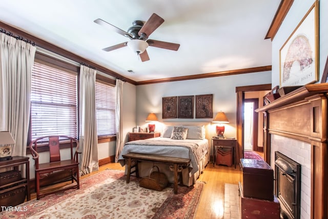 940 Park St, Bristol, VA 24201 - bedroom featuring a fireplace with flush hearth, light wood-type flooring, crown molding, and a ceiling fan