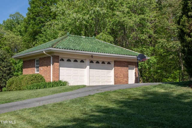 940 Park St, Bristol, VA 24201 - view of side of property featuring a garage, brick siding, asphalt driveway, and a lawn
