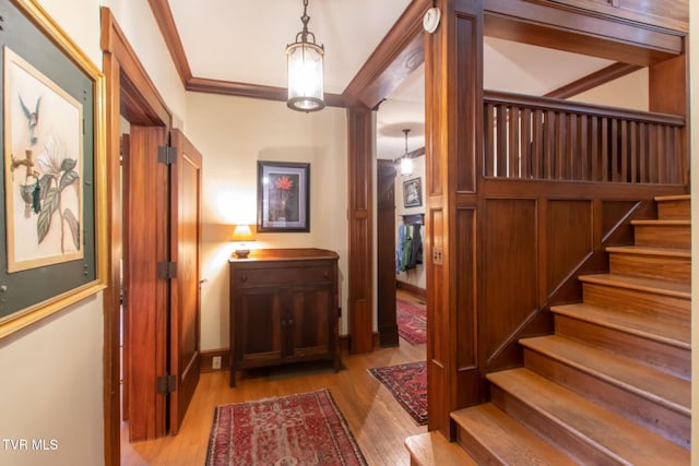940 Park St, Bristol, VA 24201 - foyer entrance featuring wood finished floors, stairway, and ornamental molding