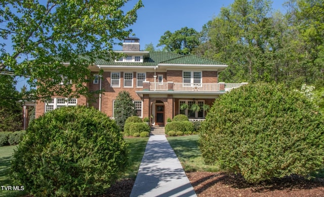 940 Park St, Bristol, VA 24201 - view of front of home featuring brick siding, a balcony, and a chimney