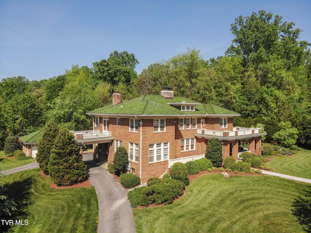 940 Park St, Bristol, VA 24201 - view of front of property featuring a chimney, a front yard, brick siding, a balcony, and driveway