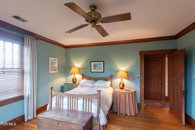 940 Park St, Bristol, VA 24201 - bedroom with crown molding, wood finished floors, and ceiling fan