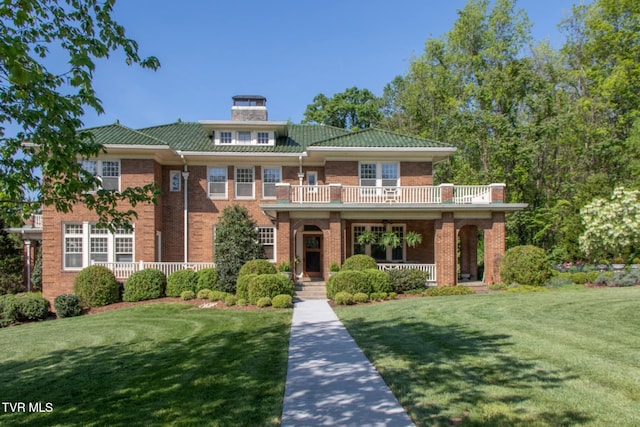 940 Park St, Bristol, VA 24201 - view of front of home with a porch, a front lawn, brick siding, and a balcony